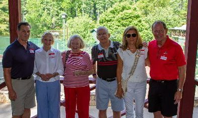 Group of Athens YMCA Camps people standing together under a pavilion outdoors