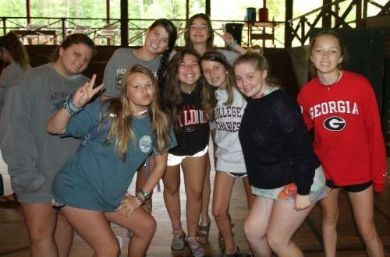 Group of campers posing together inside a building at Athens YMCA Camps